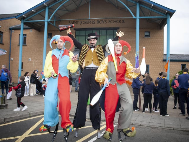 Some of the colourful characters in the grounds of St. Josephâ€TMs Boys School before the start of Fridayâ€TMs parade.