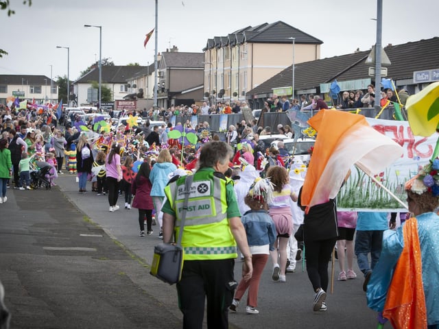 The parade makes its way across Central Drive on Friday evening.