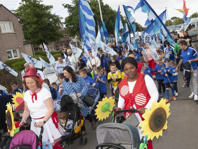 Families make their way up Westway during Friday eveningâ€TMs Creggan parade.