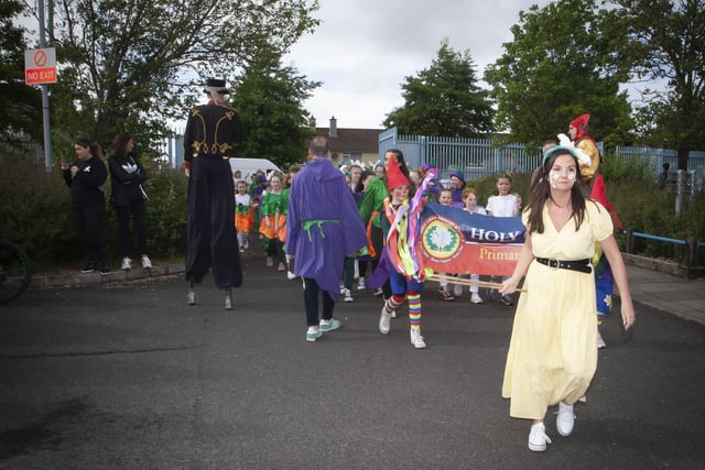 The Holy Child PS group make their way into St. Josephâ€TMs Boys School on Friday evening before the start of the Creggan Mid-Summer Carnival Parade to celebrate 75 years. (Photos: JIm McCafferty Photography)