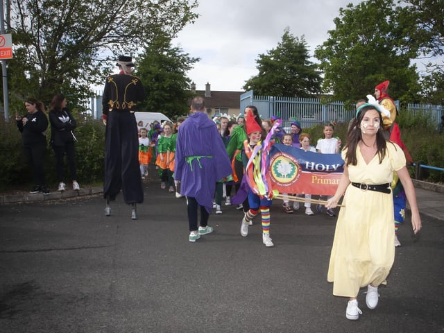 The Holy Child PS group make their way into St. Josephâ€TMs Boys School on Friday evening before the start of the Creggan Mid-Summer Carnival Parade to celebrate 75 years. (Photos: JIm McCafferty Photography)