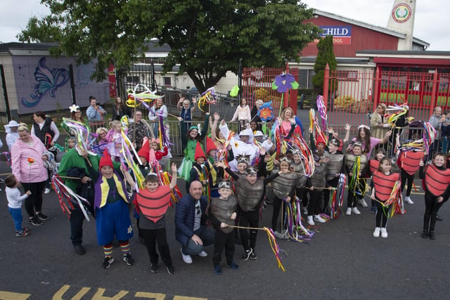 Pupils from Holy Child PS pose for a picture outside their school during Fridayâ€TMs Creggan Mid-Summer Carnival Parade.