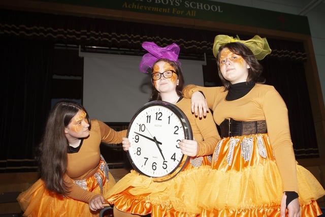 CHECKING THE TIME. . . .St. Ceciliaâ€TMs College girls Shannon Mooney, Cara-Leigh Doherty and Nicole Doran checking the time to go before the start of Fridayâ€TMs 75th Celebration Creggan Parade.