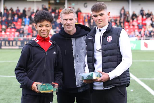 Republic of Ireland James McClean presented Trent Kone-Doherty and Fintan Doherty with their international caps at Friday night's game. Picture by Kevin Moore/MCI