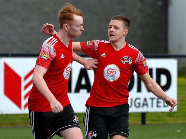 Scorer of Maiden City’s first goal against Institute, Dylan McGavigan (right) is congratulated by Brendan Moore. Picture by George Sweeney.