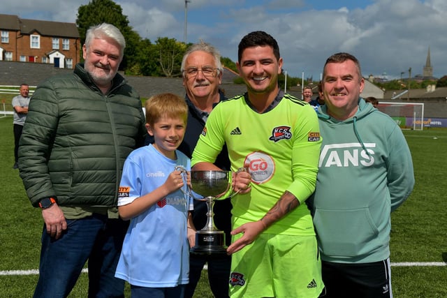 Maiden City captain Ray Kelly receives the Palmer/McDaid trophy from James Palmer after his side defeated Institute on penalties. Included in the photograph are Barry McDaid, on the left, Martin Palmer and Declan Palmer. Picture by George Sweeney.