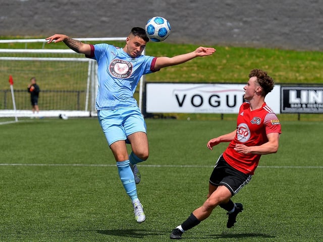 Institute’s Rhys McDermott head the ball clear as Maiden City’s Josh Kee closes in during the Palmer/McDaid Summer Cup final on Saturday afternoon. Picture by George Sweeney.