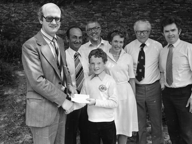 11-years-old Mark Woods, of St. Joseph’s N.S., Moville, overall winner of the essay competition ‘Water Pollution’, pictured receiving his surprise from Alan Kelly, Donegal County Council. Included, from left, are Nicholas Woods, Councillor Paddy Keaveney, Ann Woods, Arthur Spears and Seamus McTeague.