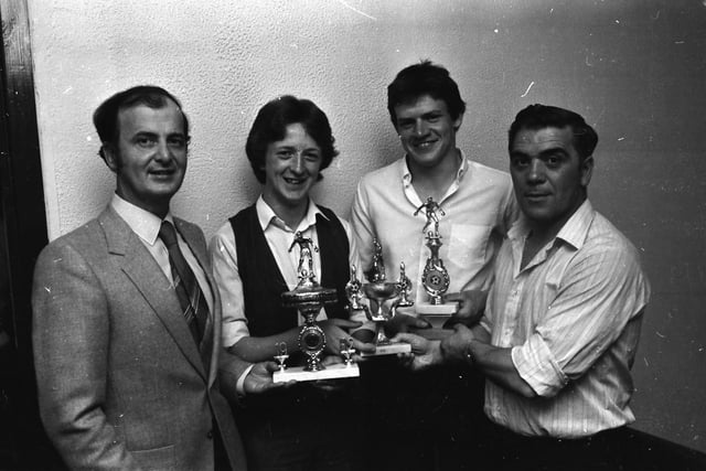 Jim ‘Jimbo’ Crossan, right, chair of the D&D FA, presenting trophies at the Top of the Hill Celtic F.C. annual presentation in Annie’s Bar. Pictured are, Chris McCallion, second from left, ‘Player of the Year’ and ‘Top Goalscorer’, Gerard McFeely, second from right, ‘Young Player of the Year’ and, on left, Matt Doherty, proprietor of Annie’s Bar.