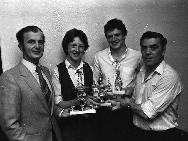 Jim ‘Jimbo’ Crossan, right, chair of the D&D FA, presenting trophies at the Top of the Hill Celtic F.C. annual presentation in Annie’s Bar. Pictured are, Chris McCallion, second from left, ‘Player of the Year’ and ‘Top Goalscorer’, Gerard McFeely, second from right, ‘Young Player of the Year’ and, on left, Matt Doherty, proprietor of Annie’s Bar.