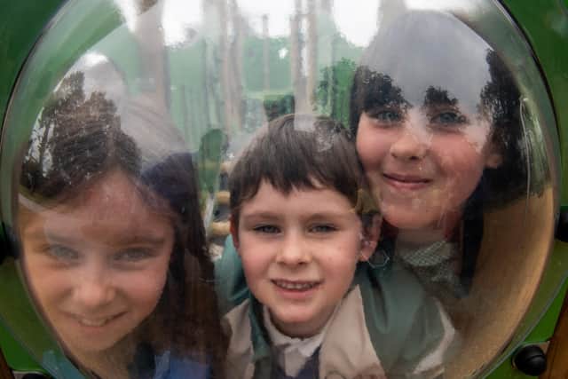Rosie, Benjamin and Mollie Bogle try out the new equipment at the reopening of Eglinton play park, by DAERA Minister Edwin Poots and Derry City and Strabane District Council Mayor, Councillor Sandra Duffy. Picture Martin McKeown. 21.06.22