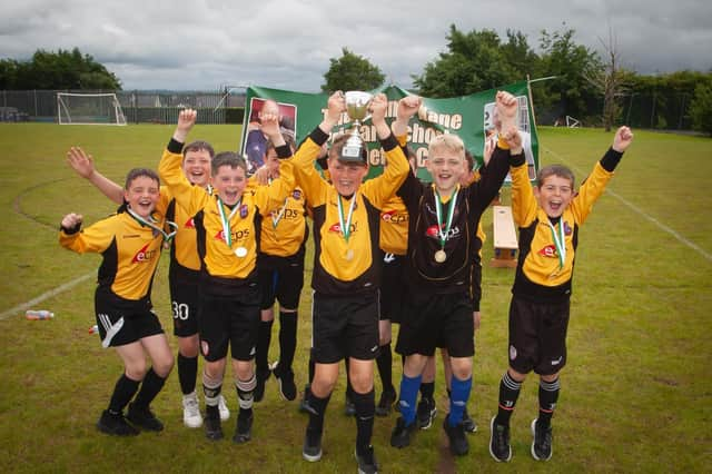 St John's celebrate with the inaugural Sean O'Kane Perpetual trophy. Photographs by Jim McCafferty.