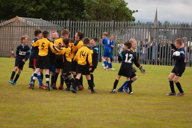 St. John's PS A team are joined by their B team to celebrate their success on Tuesday afternoon at St. Joseph's.