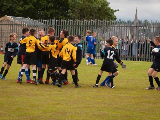 St. John's PS A team are joined by their B team to celebrate their success on Tuesday afternoon at St. Joseph's.