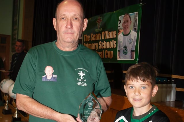Kian Gibbons, Greenhaw PS receiving the Fair Play award from Mr. Feargal O'Kane.