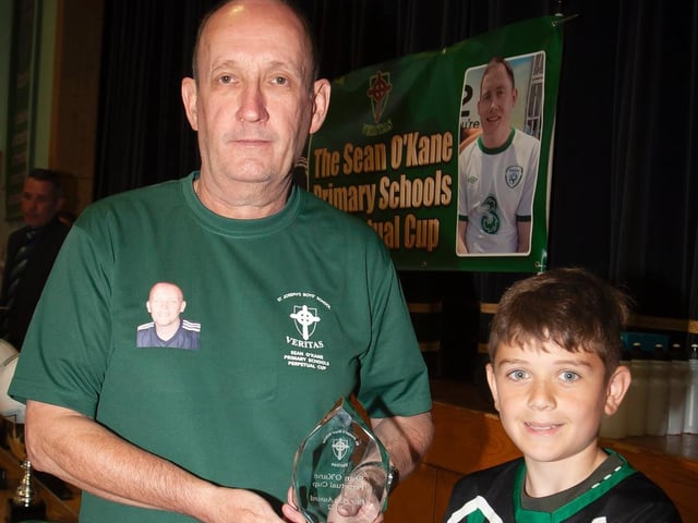 Kian Gibbons, Greenhaw PS receiving the Fair Play award from Mr. Feargal O'Kane.