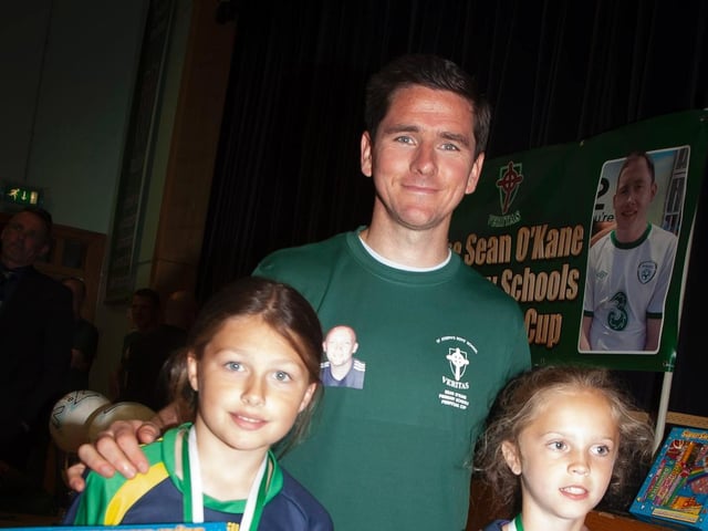 Kayla Starrs, Long Tower PS and Lauren Gallagher, Greenhaw PS - goalkeepers of the tournament pictured with Gareth McGlynn.