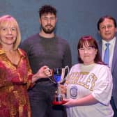 Rebecca Wray receives the Gerard Finnegan Memorial Cup from Maire Finnegan at NWRC's Best in FE celebrations. Also pictured are special guest Danny Quigley and NWRC Principal and Chief Executive Leo Murphy.