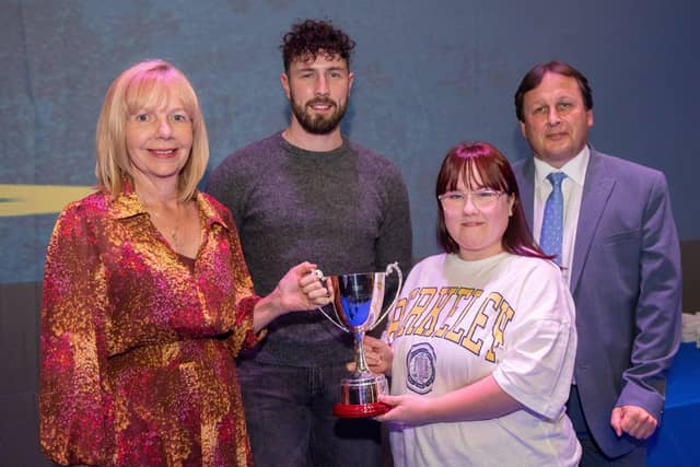 Rebecca Wray receives the Gerard Finnegan Memorial Cup from Maire Finnegan at NWRC's Best in FE celebrations. Also pictured are special guest Danny Quigley and NWRC Principal and Chief Executive Leo Murphy.