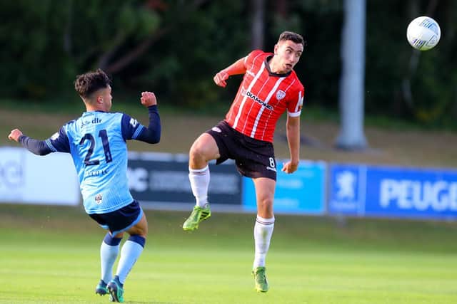 Derry City's Joe Thomson wins this header before UCD's Sean Brennan, during Friday night's game. Picture by Kevin Moore/MCI