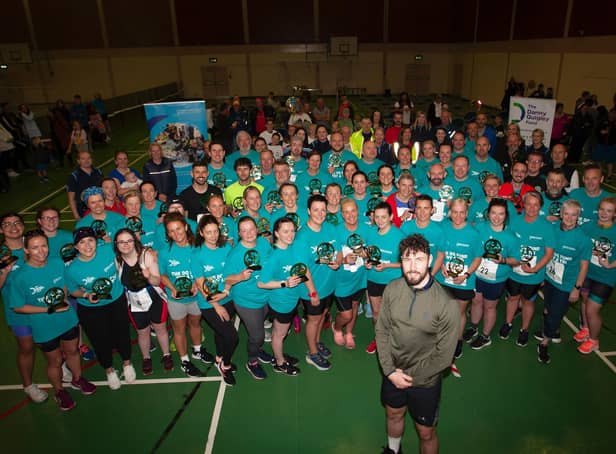 Danny Quigley pictured with participants, organisers and staff from the Bogside Brandywell Health Forum at the end of Sunday's DQF Try-A-Tri at Templemore Sports Complex. (Photos: Jim McCafferty)