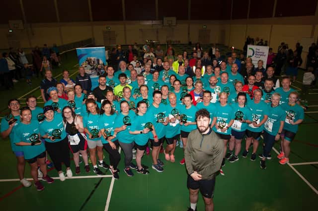 Danny Quigley pictured with participants, organisers and staff from the Bogside Brandywell Health Forum at the end of Sunday's DQF Try-A-Tri at Templemore Sports Complex. (Photos: Jim McCafferty)