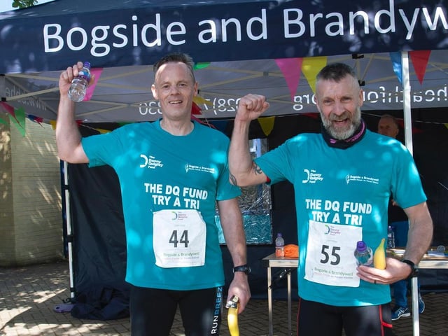 Brothers, Adrian McMonagle and Stephen McMonagle, celebrate after finishing Sunday's gruelling Triathlon. (Photo: Jim McCaferty)