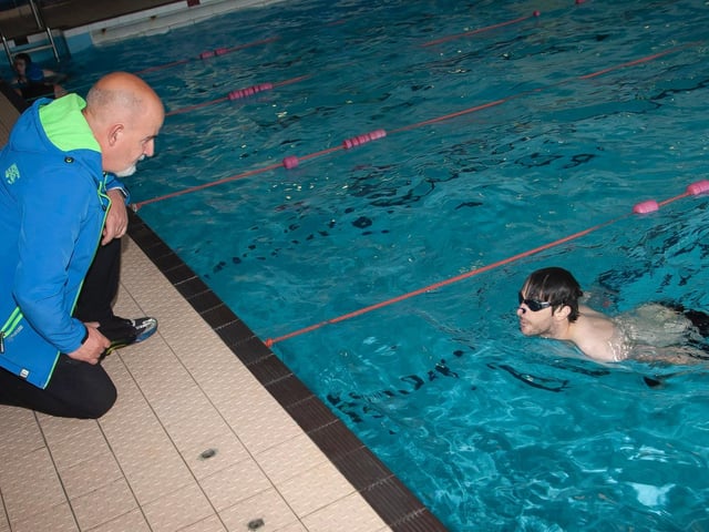 James Edwards gets some information from dad Sam during his time in the pool at Sunday's Triathlon at Templemore Sports Complex. (Photo: Jim McCafferty)