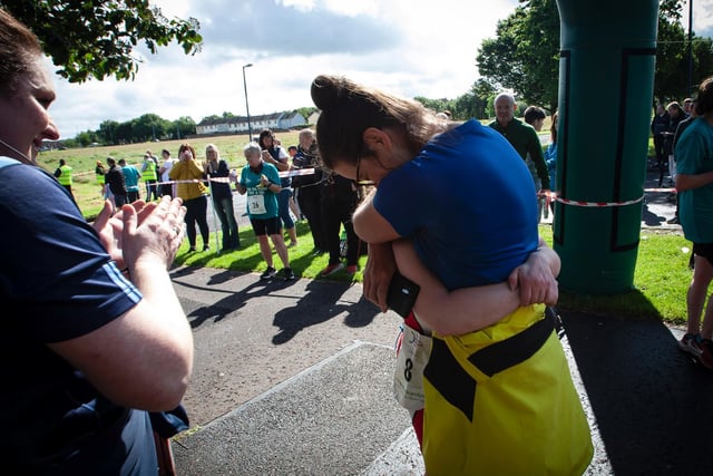 Big hug from mum for Jill after finishing Sunday's Triathlon. (Photo: Jim McCafferty)