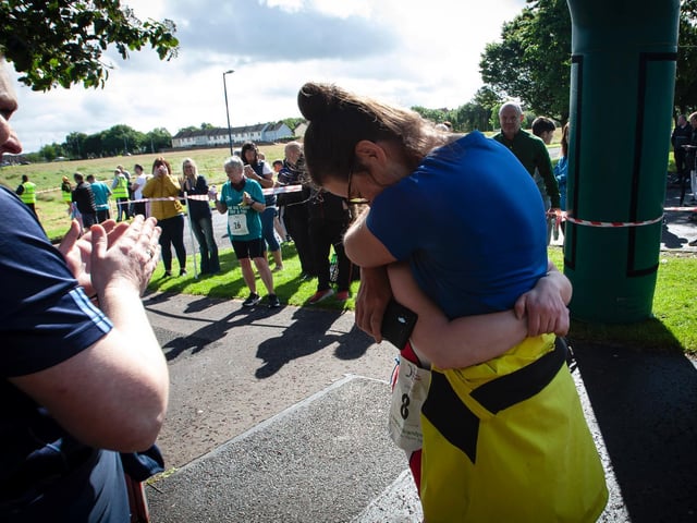 Big hug from mum for Jill after finishing Sunday's Triathlon. (Photo: Jim McCafferty)