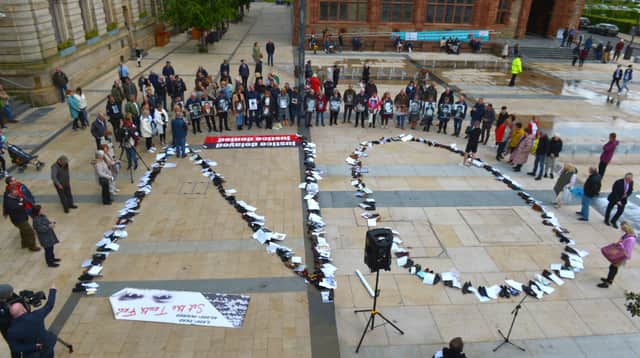 Footwear of victims of the Troubles arranged to spell ‘NO’ at a protest against the proposed Northern Ireland Troubles (Legacy and Reconciliation) Bill held at Guildhall Square last month. Photo: George Sweeney. DER222GS – 015