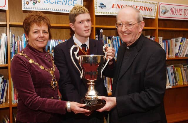 The Mayor of Derry Councillor Lynn Fleming and Father Oliver Crilly, guest speaker and Board of Governors, pictured with Paul Hughes who received an award for Irish at the Immaculate Conception College prizegiving.