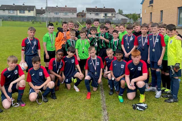 Year 8 pupils from both St Joseph’s and Lisneal College stand together after the inaugural ‘Sean O’Kane Memorial Cup’ game.