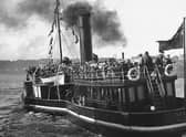 Anchor Line’s paddle tender Seamore, under full head of steam, departs Derry quay with over 300 emigrants and heads downstream to connect with a transatlantic liner, anchored off Moville. In May 1928, the Anchor Line had acquired the Clyde Shipping Company’s tug-tender America and renamed her Seamore. The Seamore was a typical tug-tender, an iron paddle steamer with one funnel and a small saloon for passengers on her after deck. Until 1939, when transatlantic liners ceased calling in Lough Foyle, the Seamore ferried passengers, emigrants and tourists between Derry and Moville. (Bigger and McDonald Collection, POR 12-14, Libraries NI)