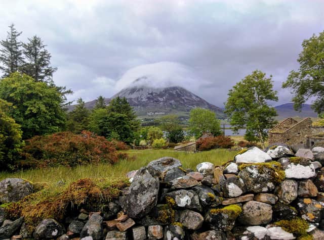 The summit of Mount Errigal shrouded in mist.