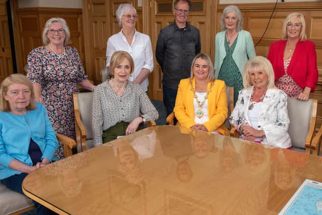 Derry City and Strabane District Council Mayor, Councillor Sandra Duffy and artist Chris Wilson pictured with the Factory Girls. Seated from left are, Eleanor Moore, Mary Doherty, Mary White and Isabel Doherty. Standing from left are, Clare Moore, Sadie Harkin, Theresa McLaughlin,  Kathleen Breslin and Rose Doherty. Picture Martin McKeown.