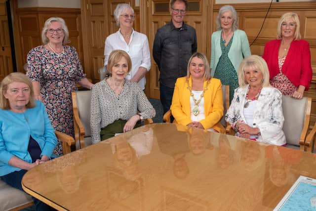Derry City and Strabane District Council Mayor, Councillor Sandra Duffy and artist Chris Wilson pictured with the Factory Girls. Seated from left are, Eleanor Moore, Mary Doherty, Mary White and Isabel Doherty. Standing from left are, Clare Moore, Sadie Harkin, Theresa McLaughlin, Kathleen Breslin and Rose Doherty. Picture Martin McKeown.