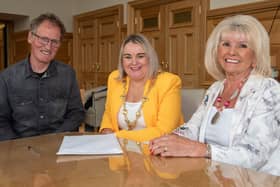 Derry City and Strabane District Council Mayor, Councillor Sandra Duffy and artist Chris Wilson pictured with the Factory Girls spokesperson  Mary White. Picture Martin McKeown.