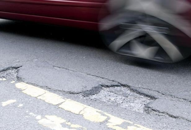 Potholes are to be repaired following the award of road surfacing contracts.