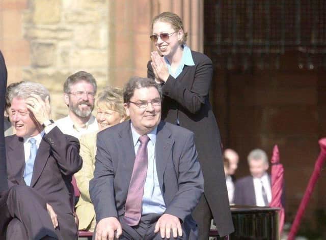 May 2001... Chelsea Clinton greets the crowd that gathered at Guildhall Sq. for the visit of her father. Included are Gerry Adams and Pat and John Hume.