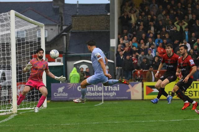 Matty Smith volleys into the roof of the net to restore Derry City's lead. Photograph by Kevin Moore.