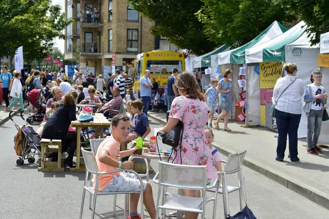 Enjoying the sunshine and a snack at a previous Foyle Maritime Festival. DER2918GS069