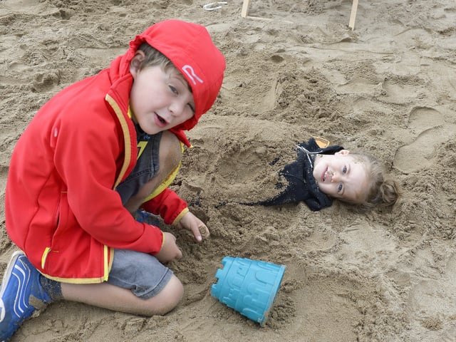 Seven-year-old Shane McDaid and his sister Scarlett (3) play in the sandpit at the Foyle Maritime Festive on Saturday afternoon last. DER2818GS051