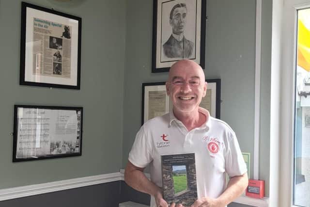 Séamus Ó Cinnéide with the recently published book about his grandfather Brian Ó Cianaigh. Brian was a pioneer of the Irish language whis his dramas and books and he also wrote Irish lessons for the Derry Journal in the mid 1930s and 1940s. Séamus' top is also embroidered with his grandfathers signature from a letter he wrote to Pádraig Mac Piarais.