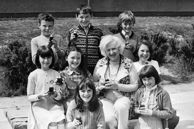 1977... Mary Guckian, principal, Holy Child PS, with pupils who won prizes in the school junior youth club competitions. Front, from left, are Ursula Deeney, Majella McKeever, Jacqueline O'Kane, Cathy Patterson and Tina Gillespie. At back are Jim Nash, Kevin Doherty and Thomas McManus.