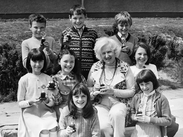1977... Mary Guckian, principal, Holy Child PS, with pupils who won prizes in the school junior youth club competitions. Front, from left, are Ursula Deeney, Majella McKeever, Jacqueline O'Kane, Cathy Patterson and Tina Gillespie. At back are Jim Nash, Kevin Doherty and Thomas McManus.