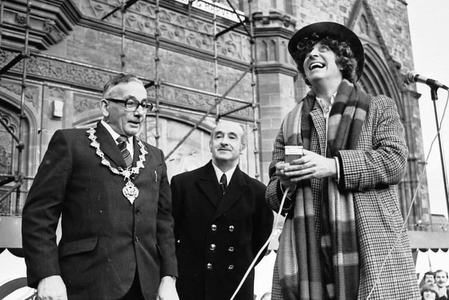 1978... TV's 'Dr Who', Tom Baker, switches on the Christmas lights at Guildhall Square,m watched by Mayor Tom Craig and Guildhall assistant superintendent Joseph Robinson.