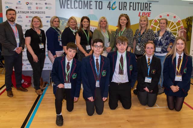 Shona Higgenbotham, Eileen McGrinder ad Emma Quinn pictured with staff and pupils from Oakgrove Integrated College and Holy Cross College as Derry City and Strabane District Council hosted the 4 C UR Your Future Live,  Skills Event in the Foyle Arena. Picture Martin McKeown.