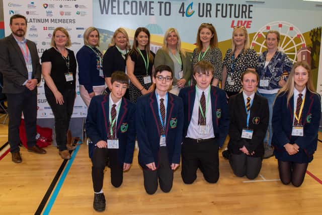 Shona Higgenbotham, Eileen McGrinder ad Emma Quinn pictured with staff and pupils from Oakgrove Integrated College and Holy Cross College as Derry City and Strabane District Council hosted the 4 C UR Your Future Live, Skills Event in the Foyle Arena. Picture Martin McKeown.