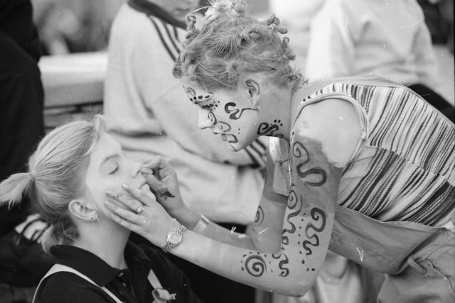 Sharon McDaid gives Martina O’Donnell, Carndonagh, a new look at the face-painting stall at the opening parade of the Carndonagh Festival.